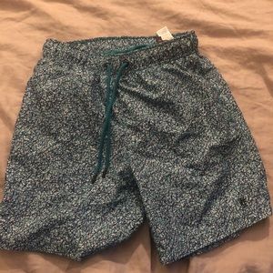 Unworn men’s blue swim trunks